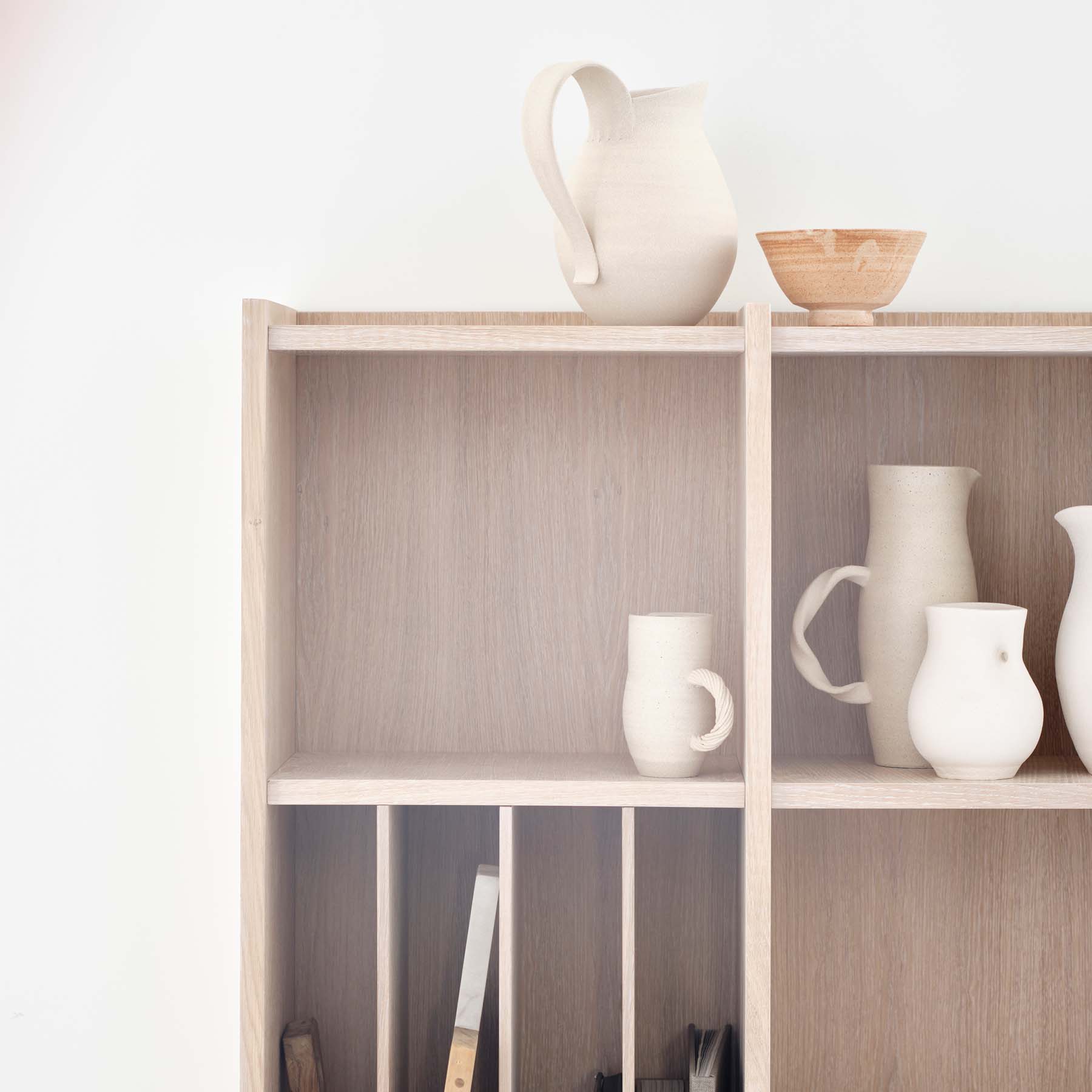 Shelving made in natural Oak veneer finish, with a touch of white pigmented oilwax.