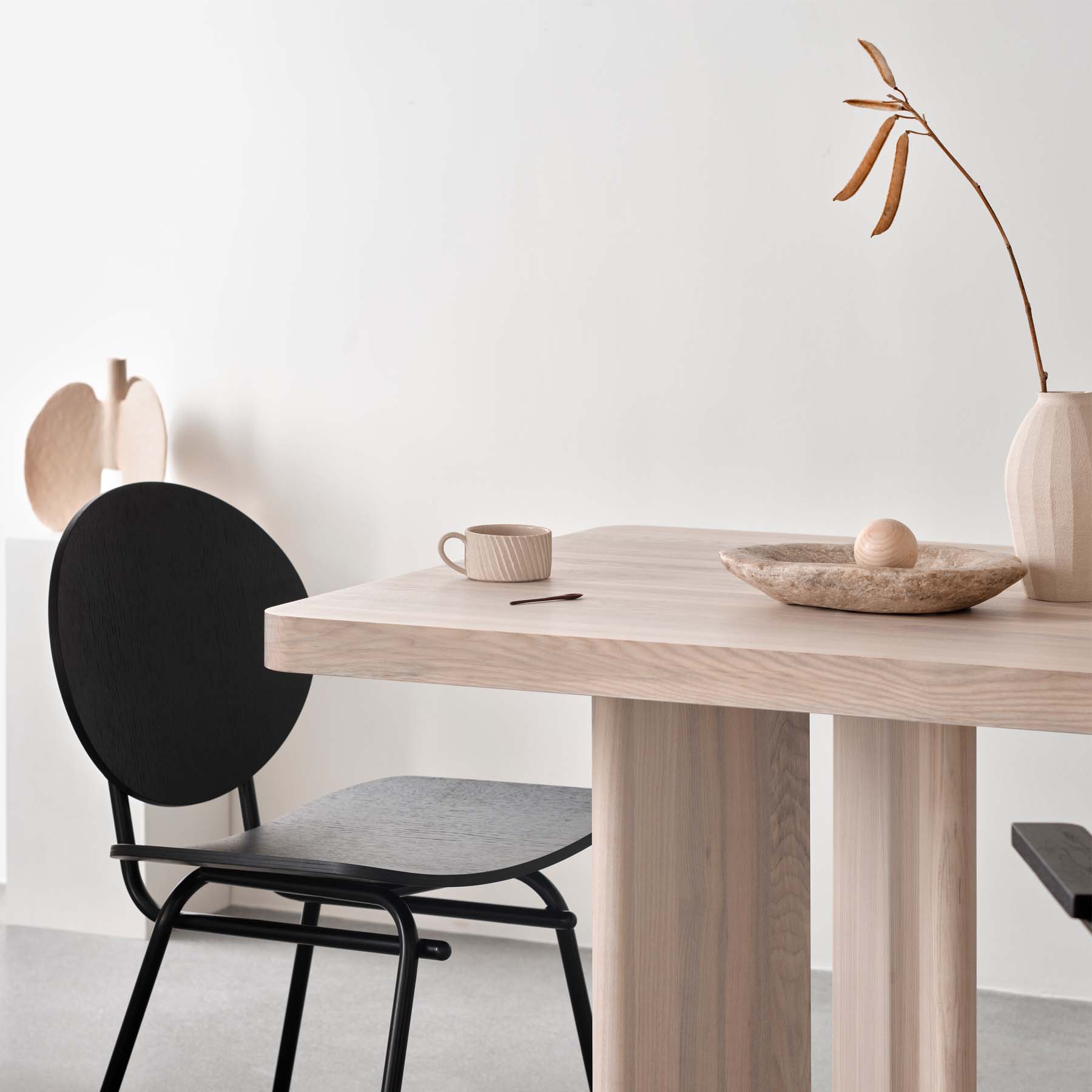 Dining room with dining table in solid oak with a black dining chair