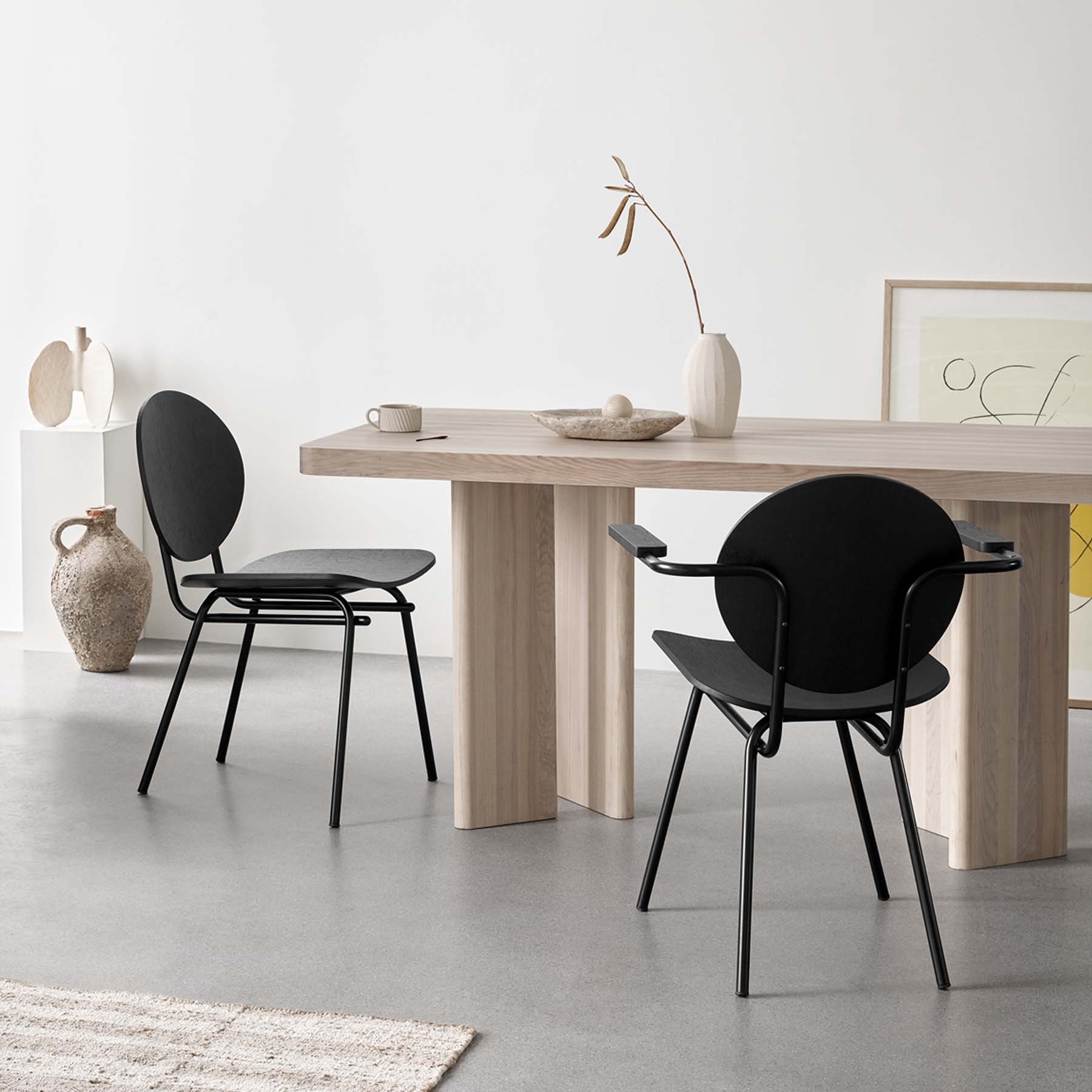 Dining table in solid ash styled with black dining chairs